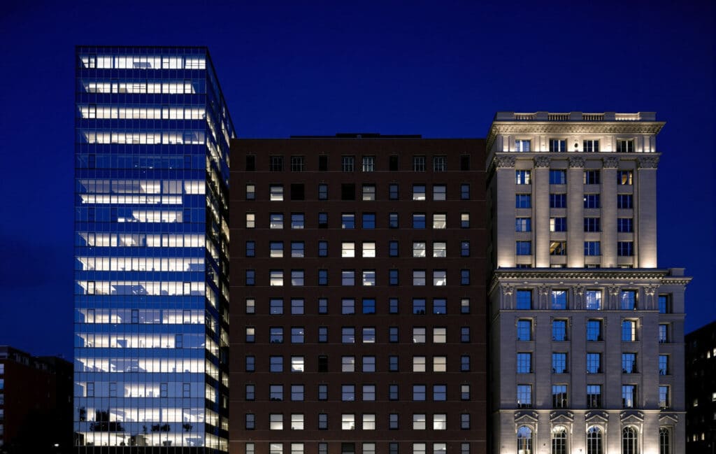 Glass, brick and classical stone office buildings side by side, illustrating the SAS, SRL and SA company types