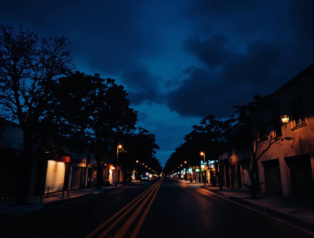 Quiet tree-lined street at blue hour, evoking the start of a business in Argentina